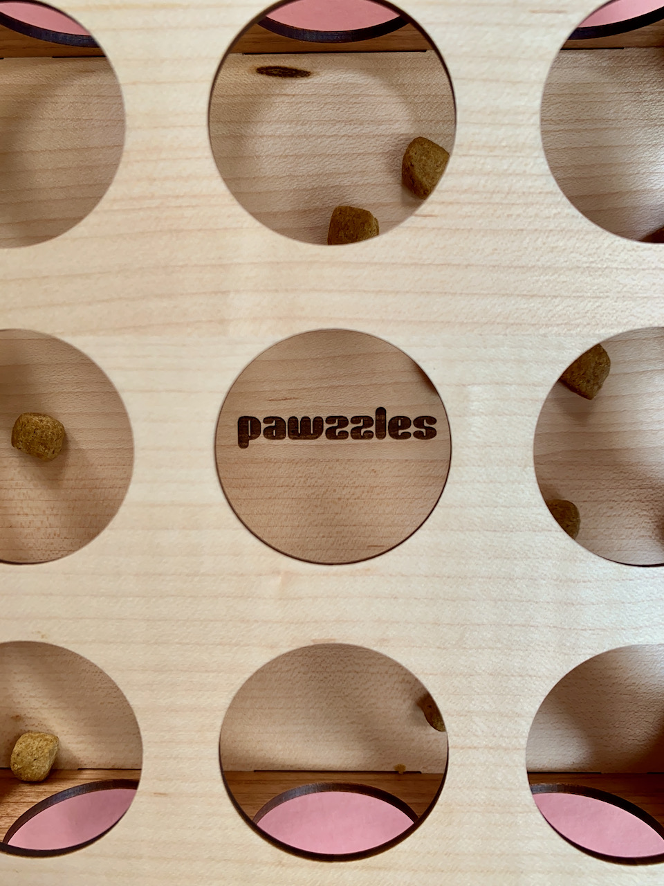 Pawzzles puzzle closeup on the engraved logo inside